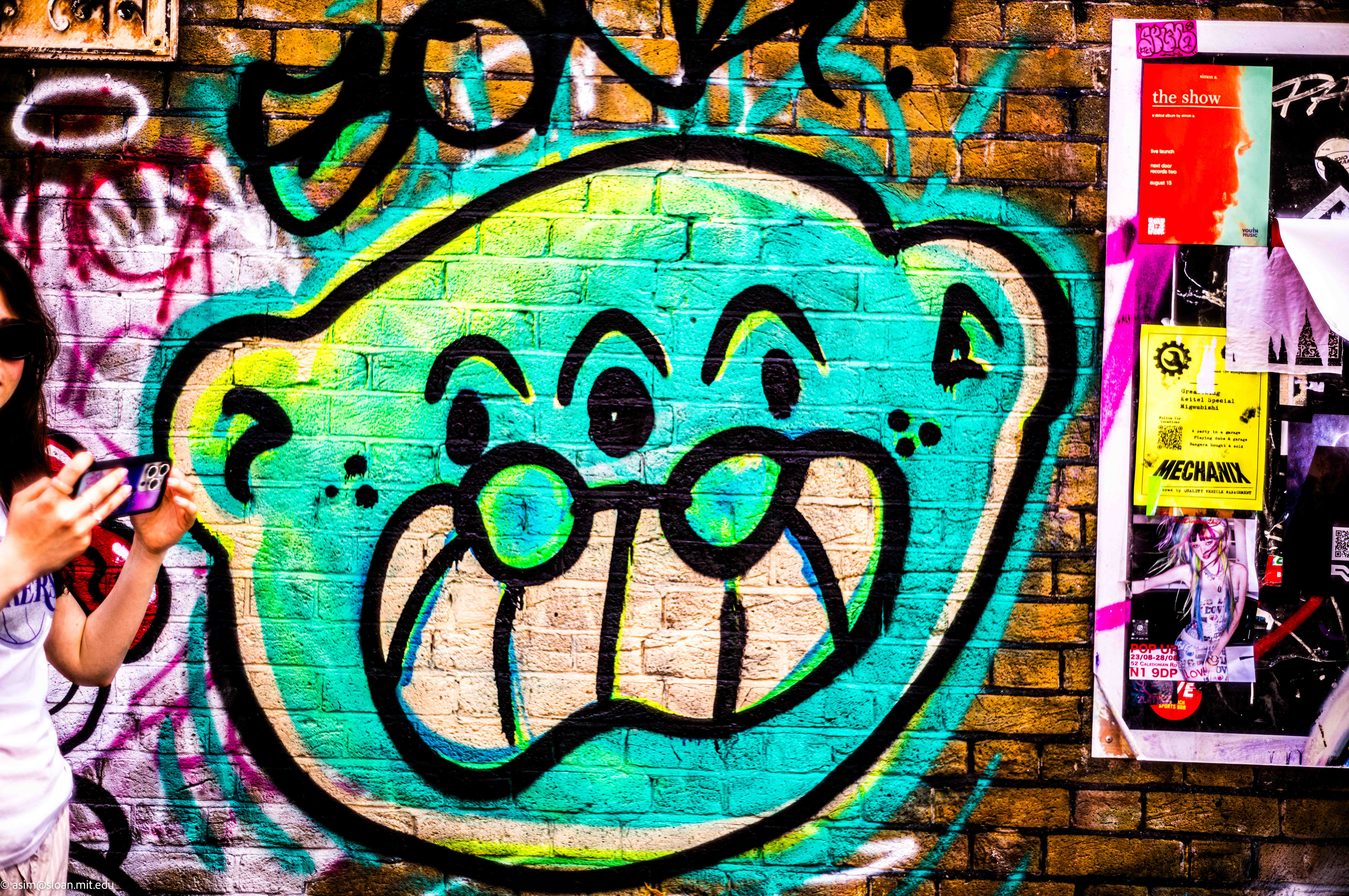 A person standing on a city street corner